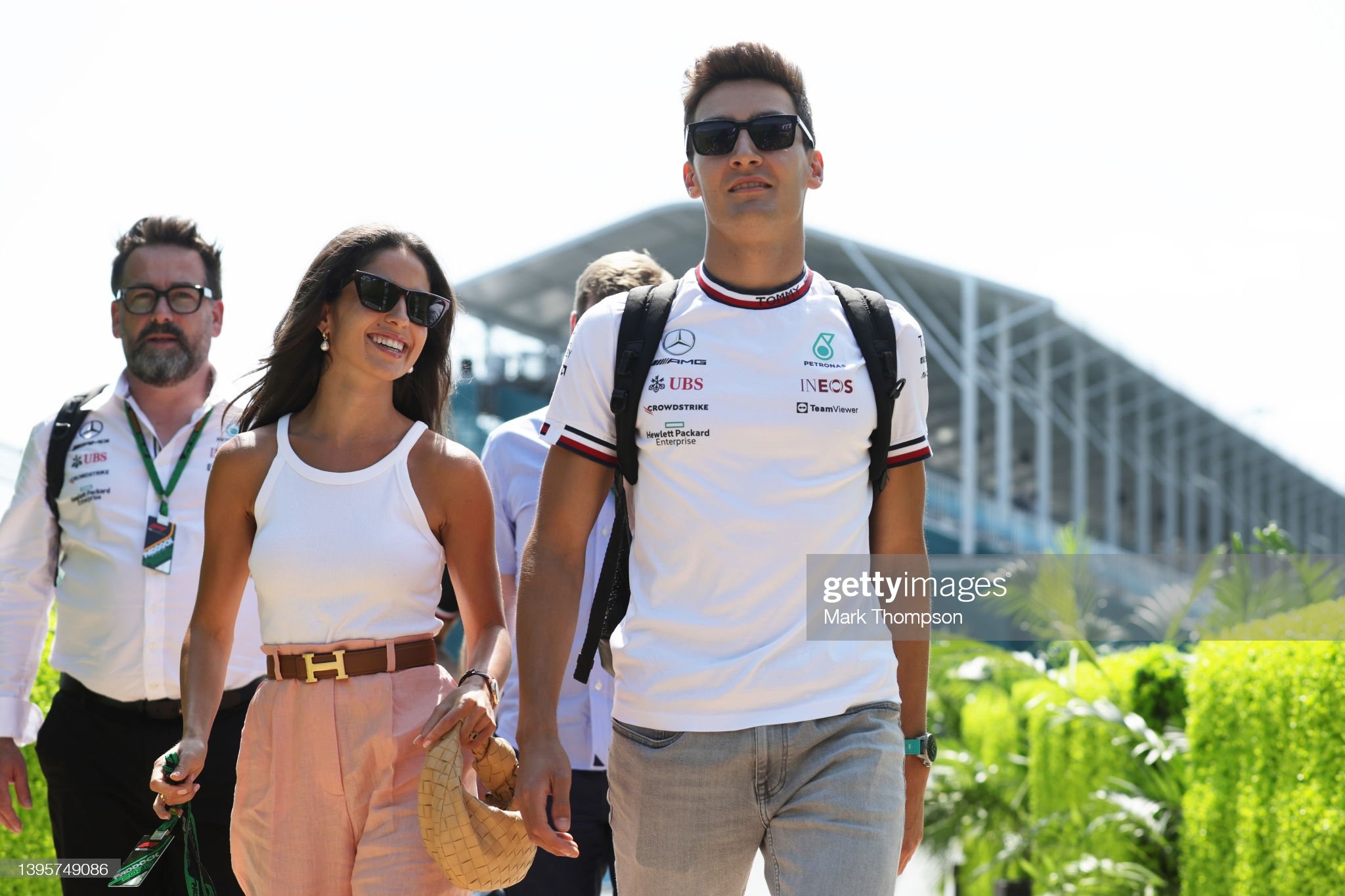George Russell of Great Britain and Mercedes walks in the Paddock with his girlfriend Carmen Montero Mundt prior to practice ahead of the F1 Grand Prix of Miami at the Miami International Autodrome on May 06, 2022 in Miami, Florida. 