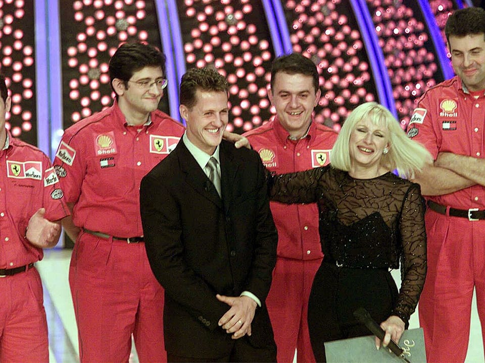 Rome, Rai Auditorium of the Foro Italico, 06 November 1999. From left: the Ferrari racing driver Michael Schumacher, guest of Raffaella Carrà in the Italian television program ‘Carràmba! What luck’ of Raiuno.