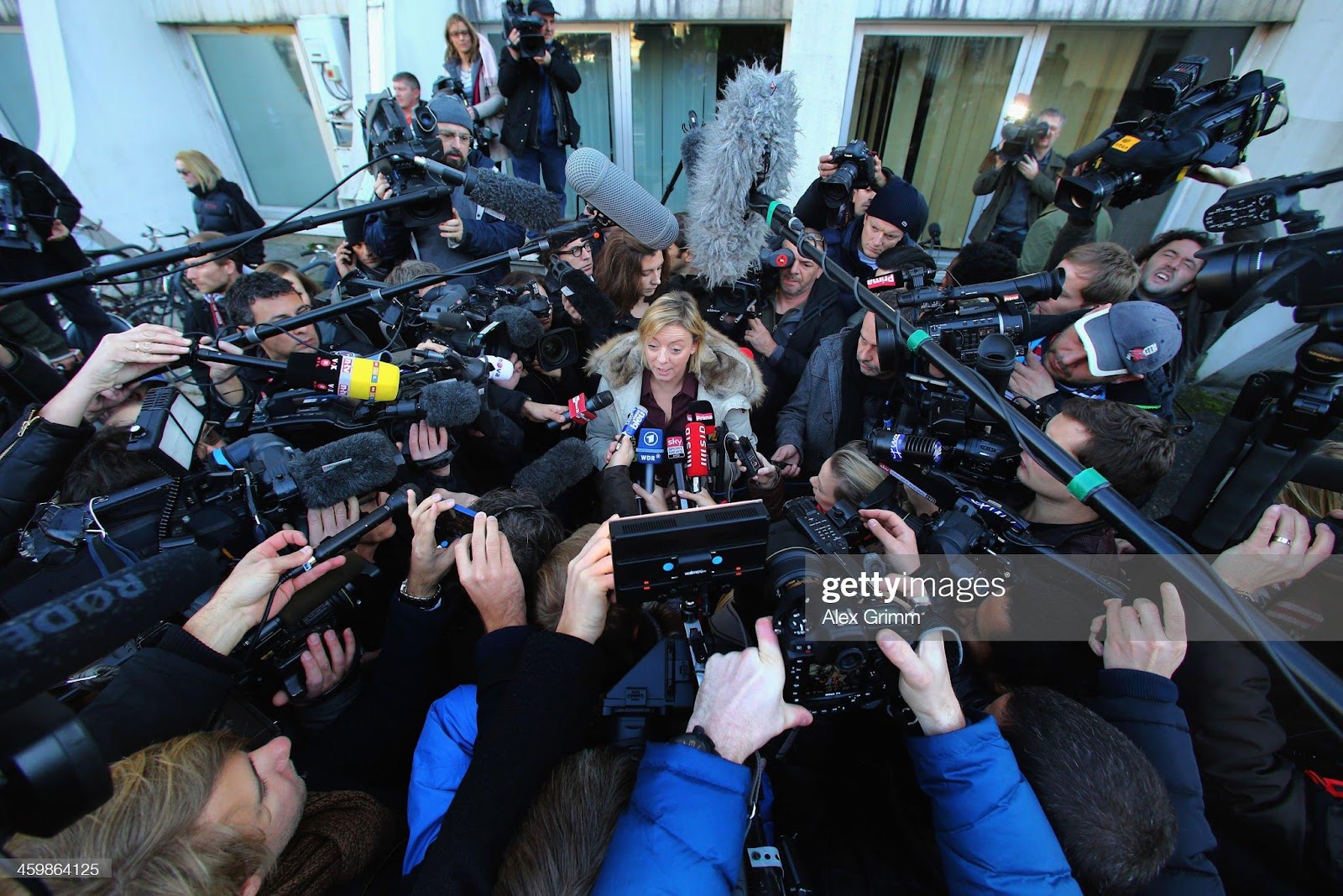 Sabine Kehm, press officer of former German F1 driver Michael Schumacher, talks to the media outside the Grenoble University Hospital Centre where Schumacher is being treated for a severe head injury following a skiing accident on Sunday in Meribel on January 1, 2014 in Grenoble, France.