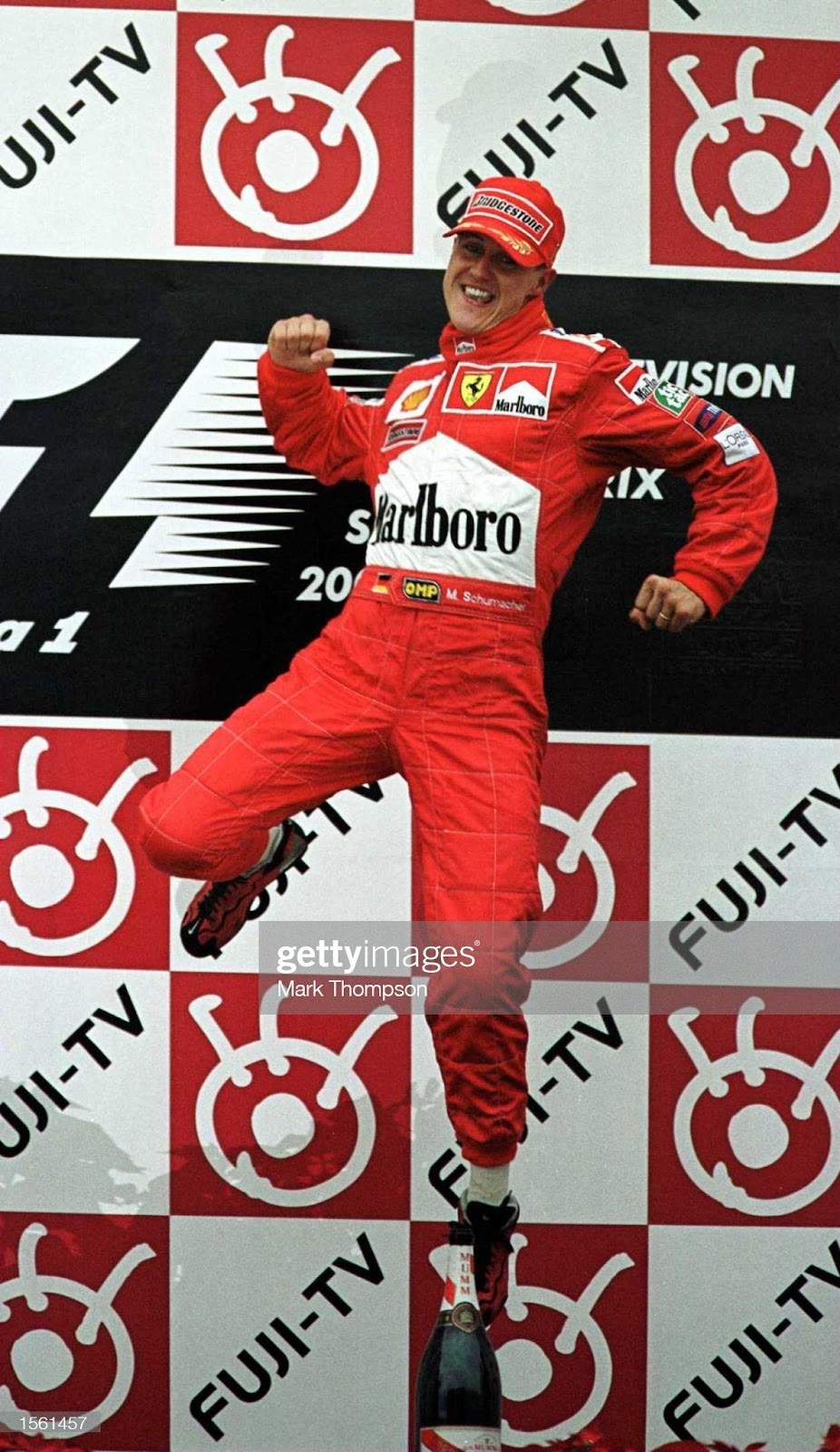 Michael Schumacher, Ferrari, celebrates on the podium after winning the F1 world championship at the Japanese Grand Prix at Suzuka on October 08, 2000.