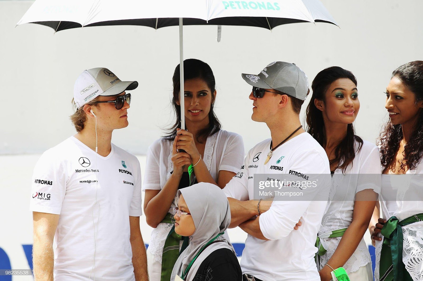 Nico Rosberg (left), Mercedes GP, team mate Michael Schumacher (right), Mercedes GP, attend the drivers parade before the Malaysian F1 Grand Prix at the Sepang Circuit on April 4, 2010 in Kuala Lumpur.