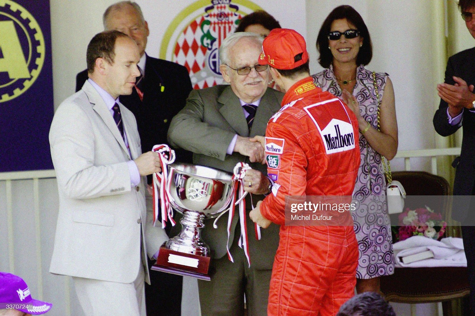 Prince Rainier III of Monaco and son Prince Albert hand the winner’s trophy to Ferrari driver Michael Schumacher at the Monaco F1 Grand Prix held on May 27, 2001 in Monte Carlo, Monaco. 