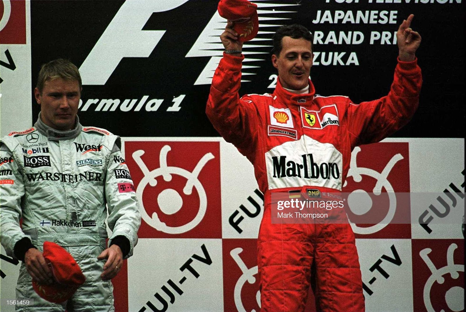 8 October 2000: Michael Schumacher, Ferrari, celebrates on the podium after winning the F1 world championship at the Japanese Grand Prix at Suzuka, Japan.