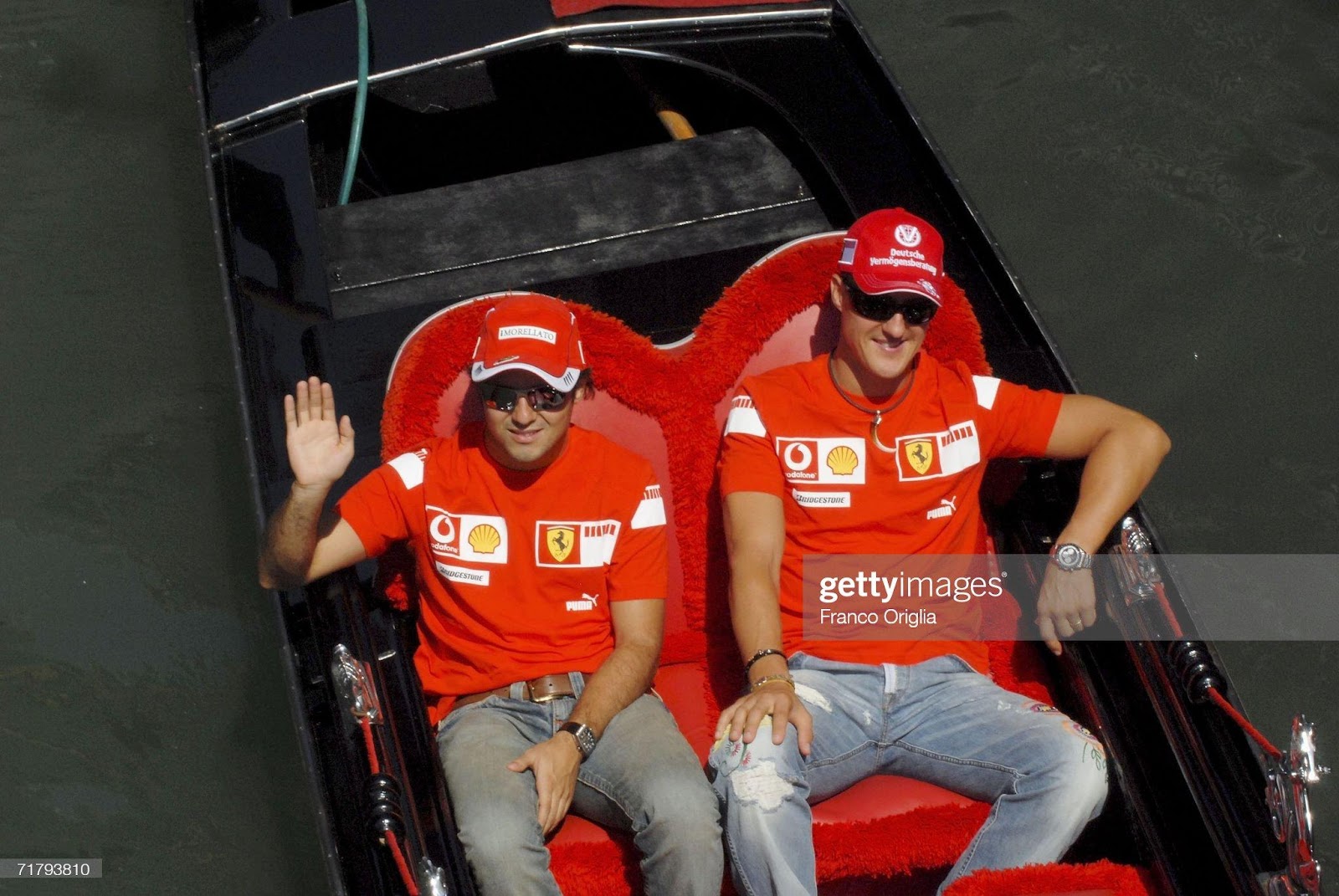 Michael Schumacher and his teammate Felipe Massa arrive in a gondola to launch the Ferrari store in Venice on September 6, 2006.