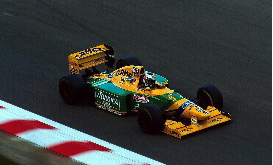 Michael Schumacher driving a Benetton.