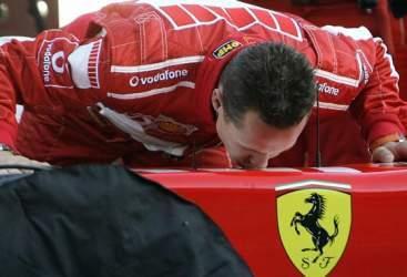 Michael Schumacher kissing his Ferrari.