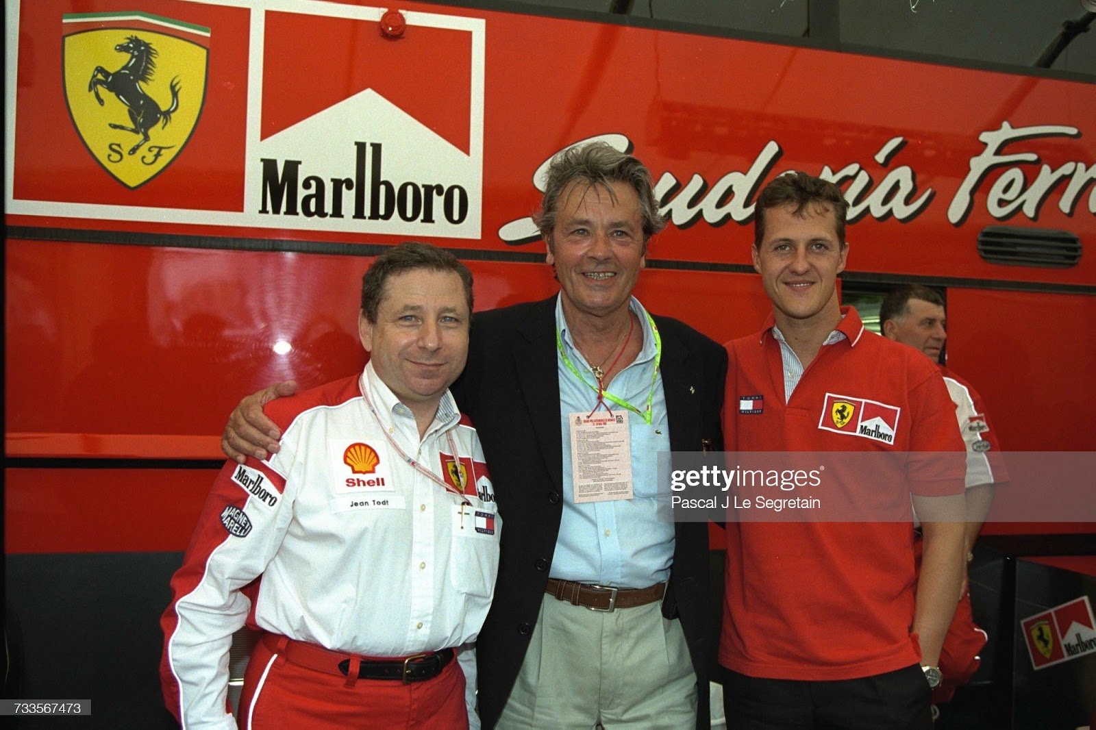 Jean Todt, Alain Delon and Michael Schumacher at the Monaco Grand Prix on May 23, 1998. 