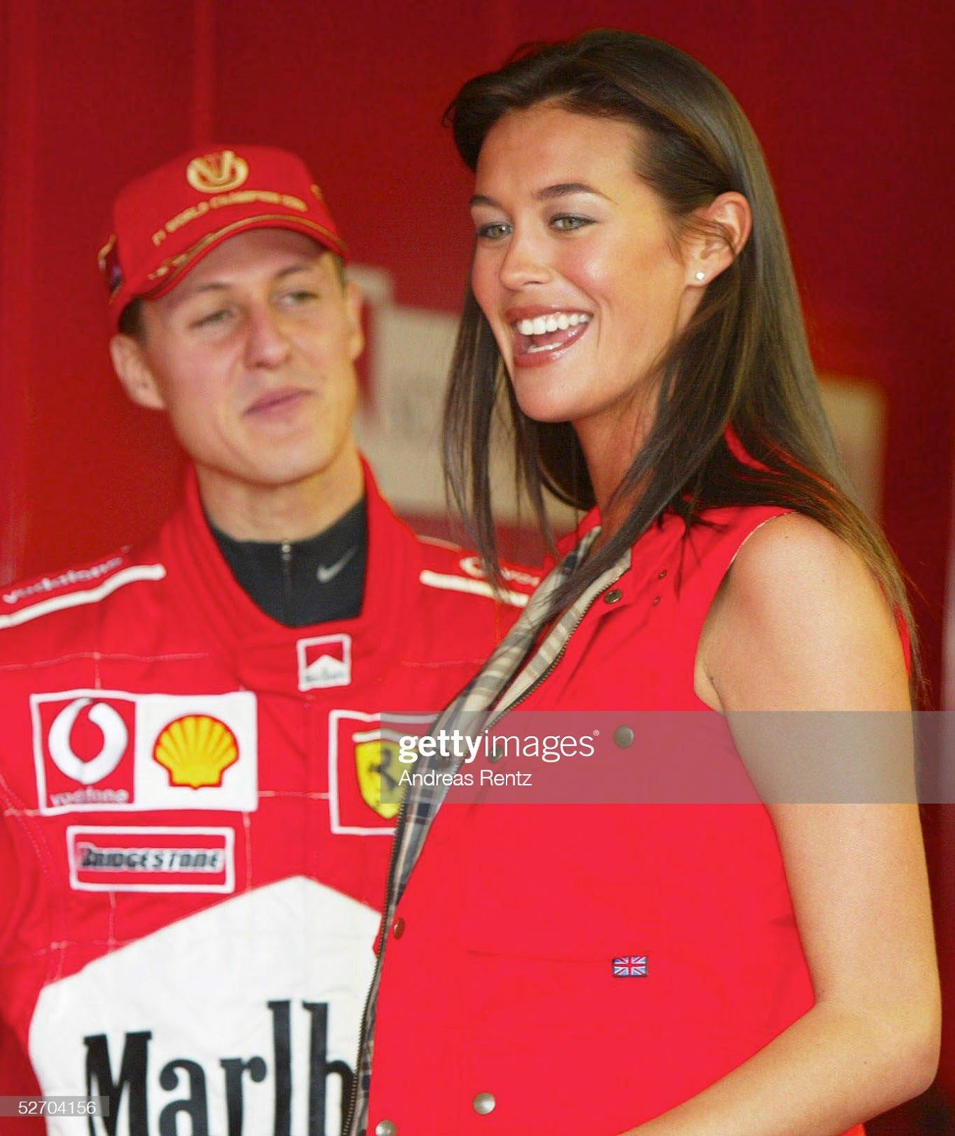 Michael Schumacher, Ferrari, with Australian model Megan Gale at the Australian Grand Prix on March 01, 2002.