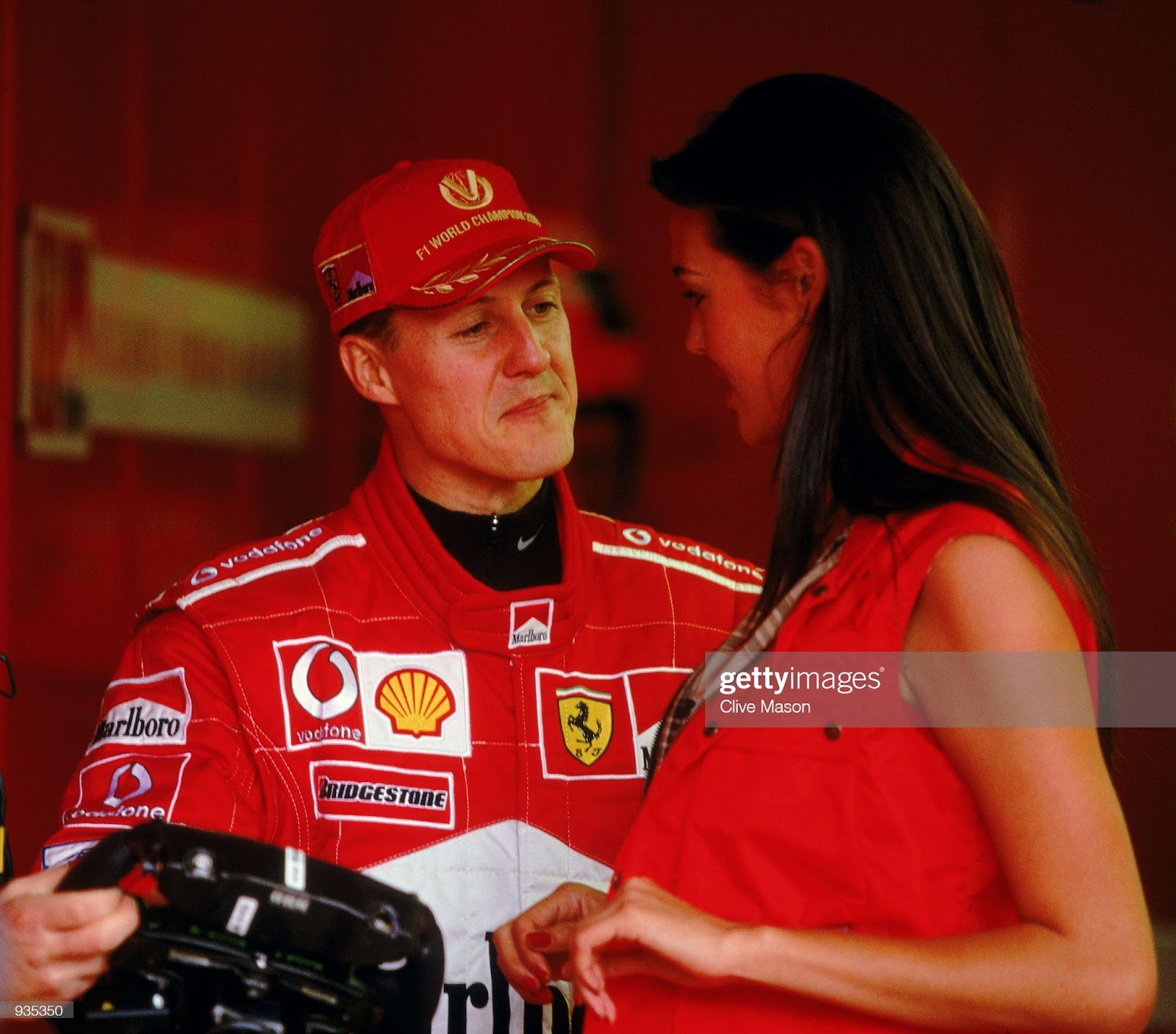Michael Schumacher, Ferrari, with Australian model Megan Gale at the Australian Grand Prix on March 01, 2002.