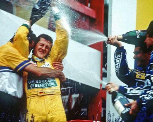 Belgium 92: champagne-drenched joy for Michael Schumacher who wins for the first time in his career at the circuit where he made his debut the previous year, preceding Mansell and Patrese at the finish line.