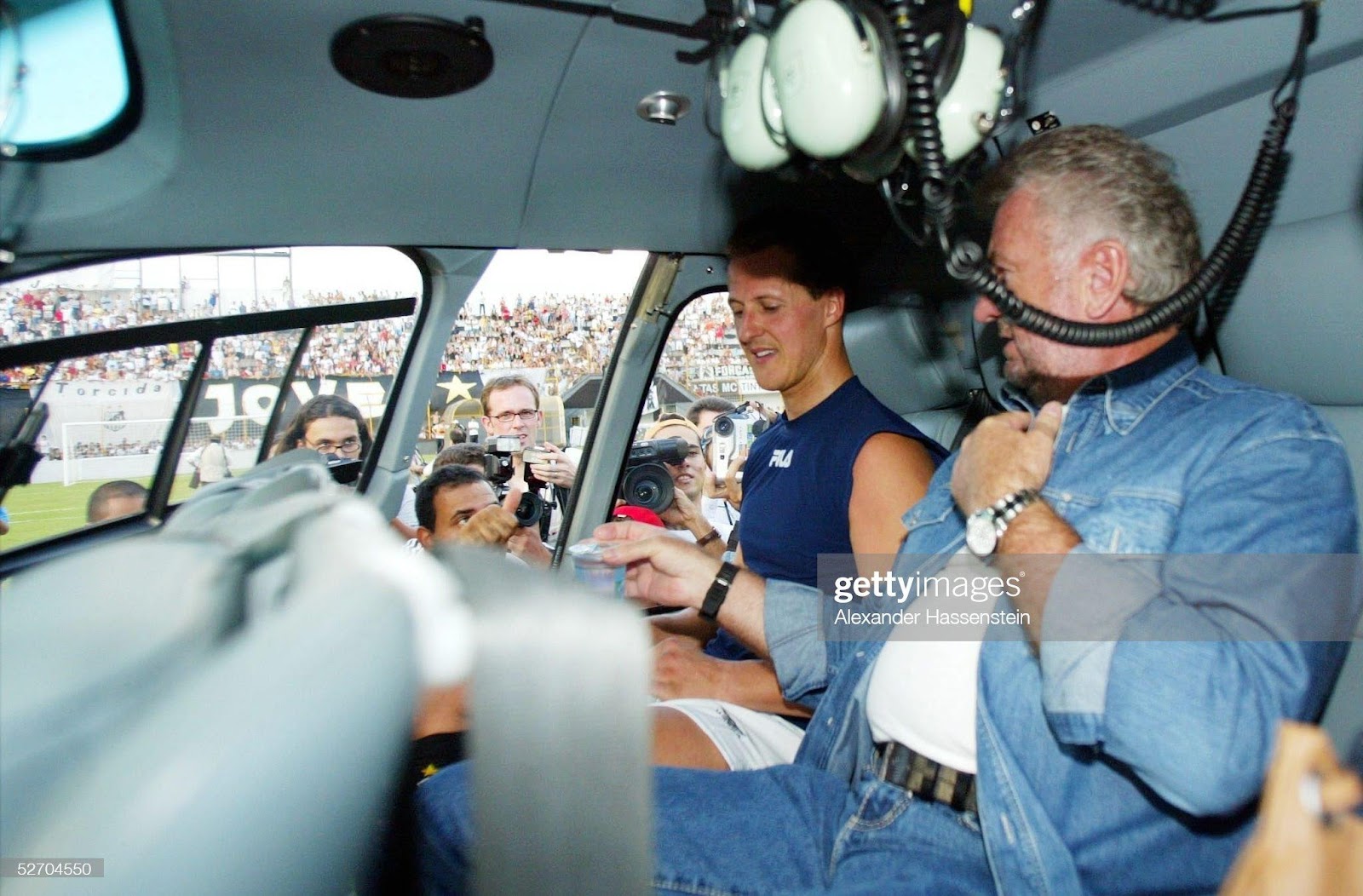Michael Schumacher on a helicopter with his manager Willi Weber.
