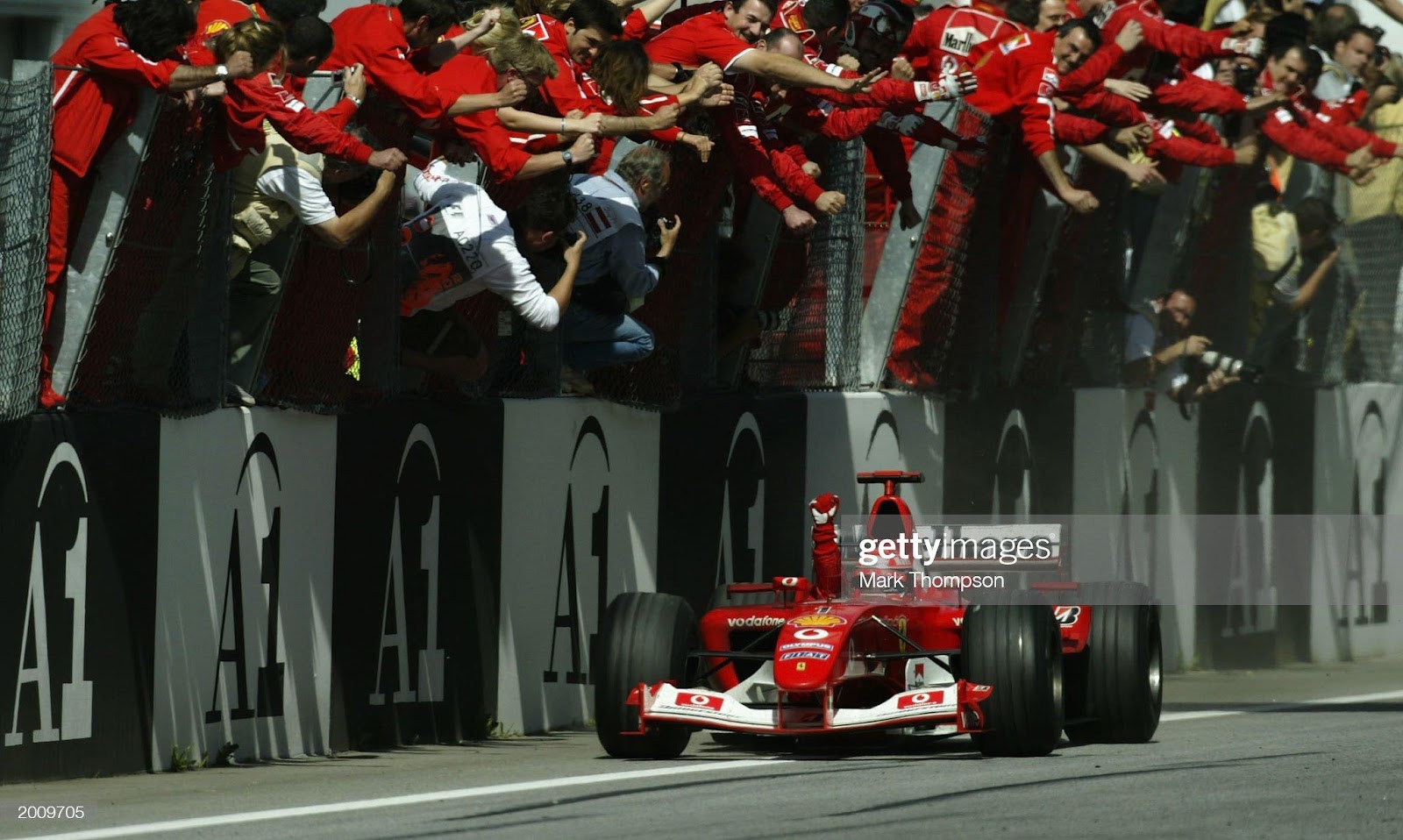 Michael Schumacher, Ferrari, crosses the finish line to win the Austrian Grand Prix on May 18, 2003 at the A1 Ring in Spielberg.