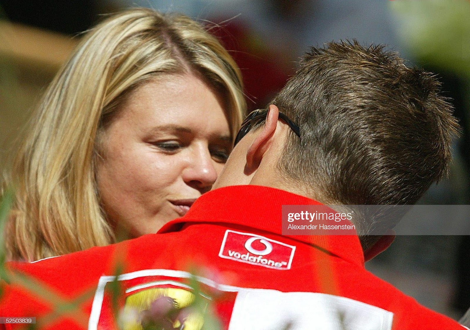 Corinna Schumacher kisses her husband Michael, Ferrari, who won the Canadian Grand Prix in Montreal on June 13, 2004.