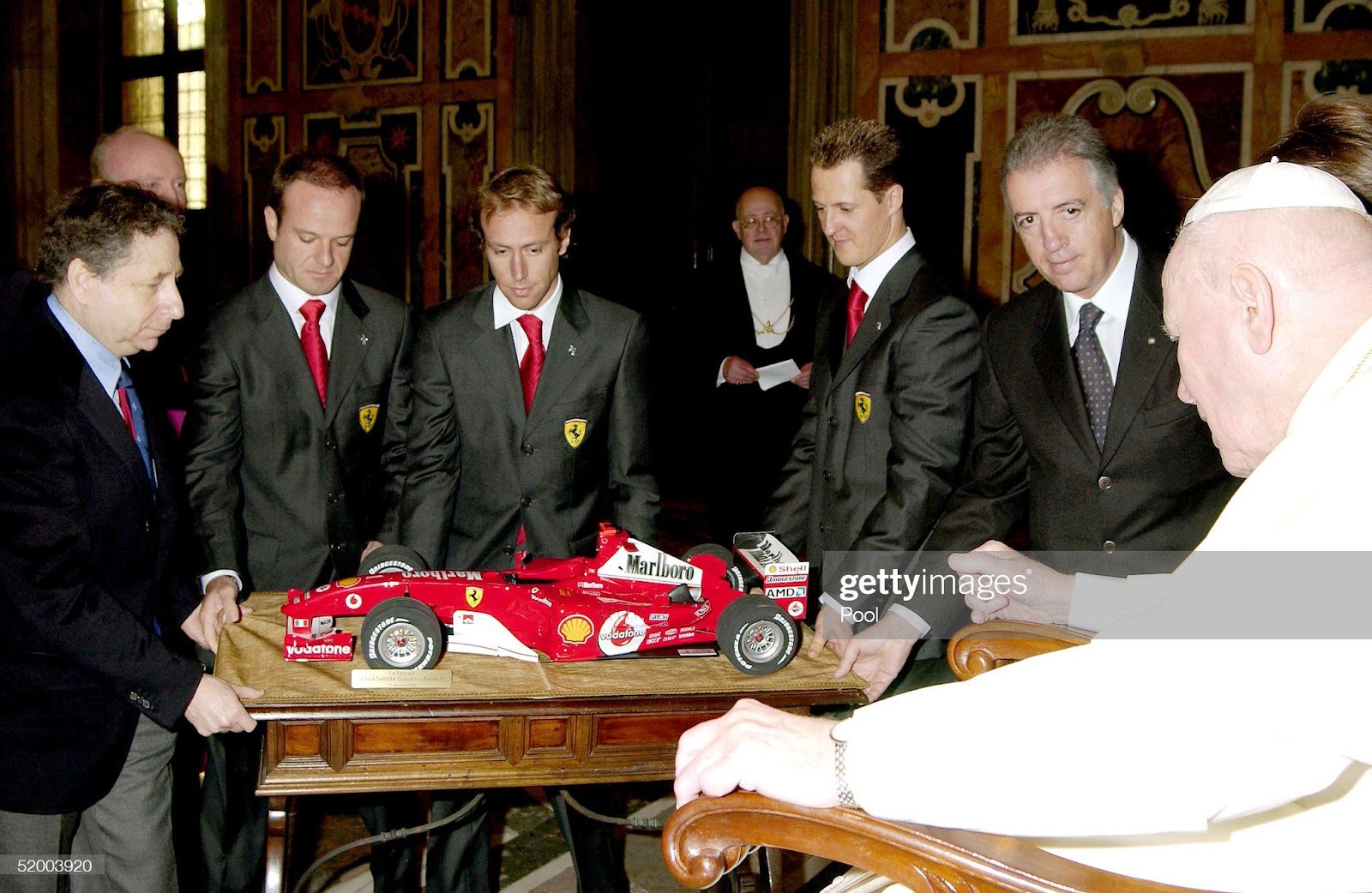 Pope John Paul II receives as a gift from Ferrari President Luca Cordero di Montezemolo, Michael Schumacher, Brazilian teammate Rubens Barrichello, Ferrari managing director, F1 team boss Jean Todt and mechanics a 1:5 scale model of the car that won Ferrari both the championship and constructor title in 2004 during a meeting at the Clementina Hall, January 17, 2005, in Vatican City. 