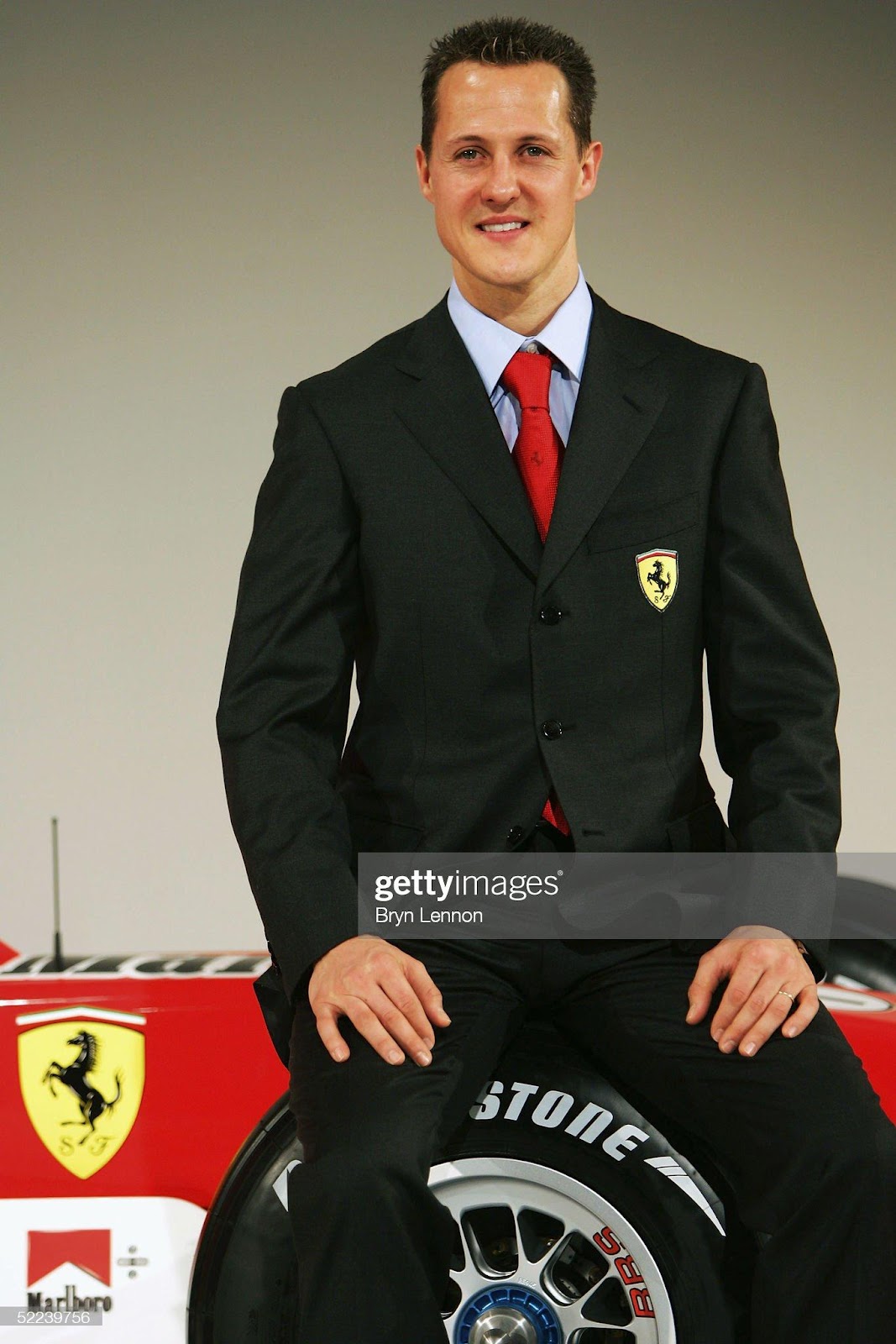 Michael Schumacher poses the new Ferrari F2005 Formula One car at the Ferrari factory on February 25, 2005 in Maranello, Italy.