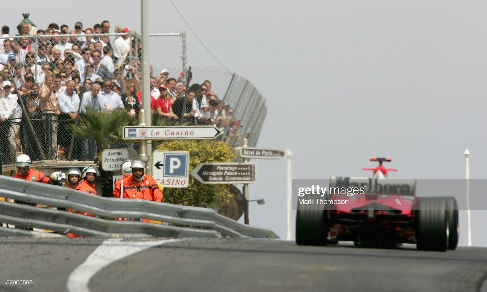 The crowds watch Michael Schumacher, Ferrari, in action on his way to Casino Square at the Monaco F1 Grand Prix on May 22, 2005, in Monte Carlo, Monaco. 