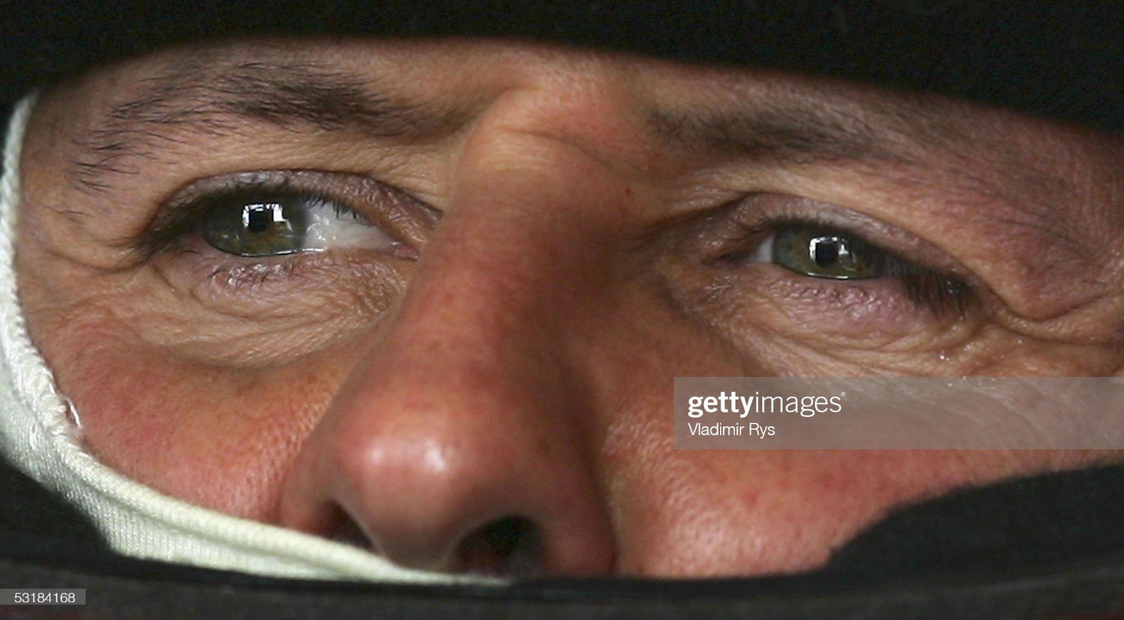 Michael Schumacher, Ferrari, looks on during the qualifying for the French F1 Grand Prix at Magny Cours on July 2, 2005.