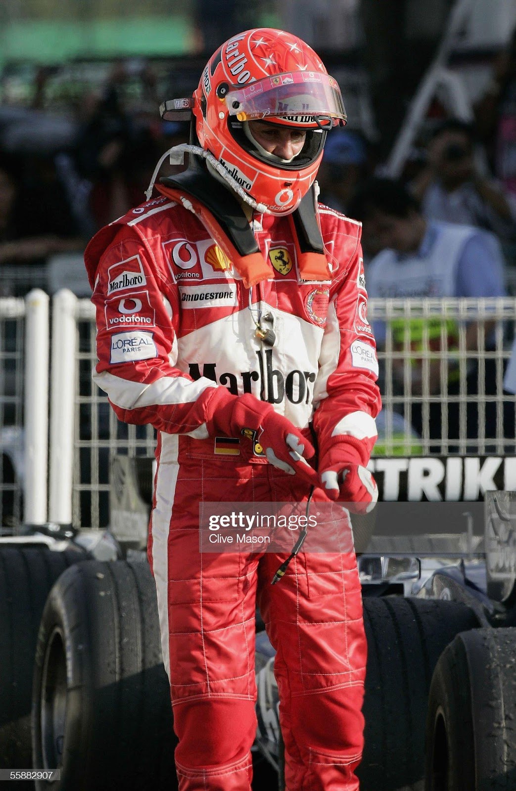 Michael Schumacher, Ferrari, walks in parc ferme after the Japan F1 Grand Prix at the Suzuka Circuit on October 9, 2005.