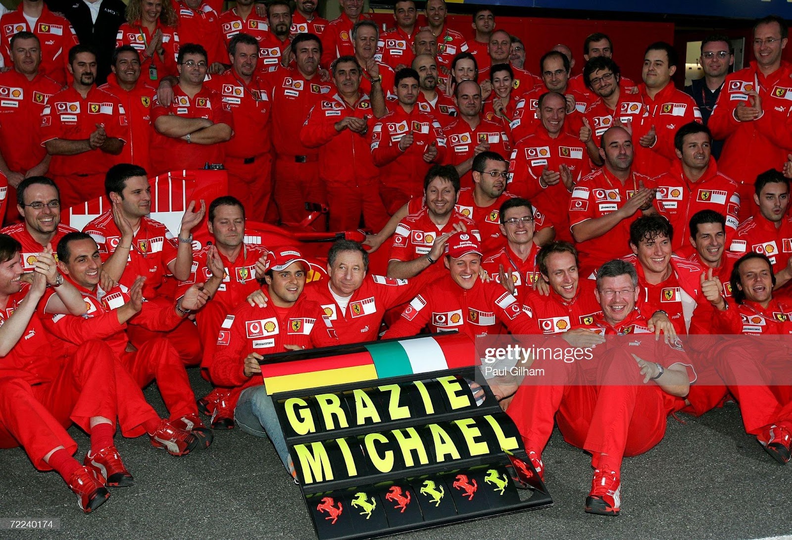 Michael Schumacher and Felipe Massa celebrate with their team-mates at the end of the Brazilian F1 Grand Prix at the Autodromo Interlagos on October 22, 2006 in Sao Paulo, Brazil.