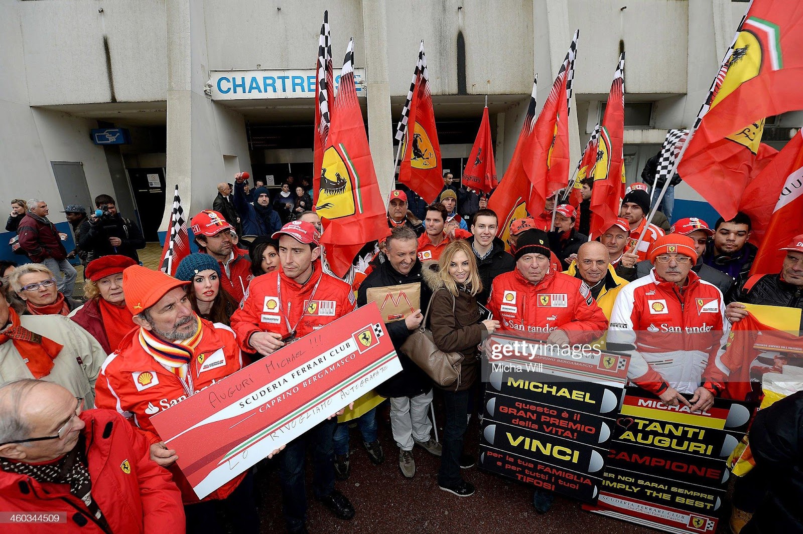 Fans gather in front of the main entrance of Grenoble University Hospital Centre where former German Formula One driver Michael Schumacher is being treated for a severe head injury following a skiing accident on January 3, 2014 in Grenoble, France.