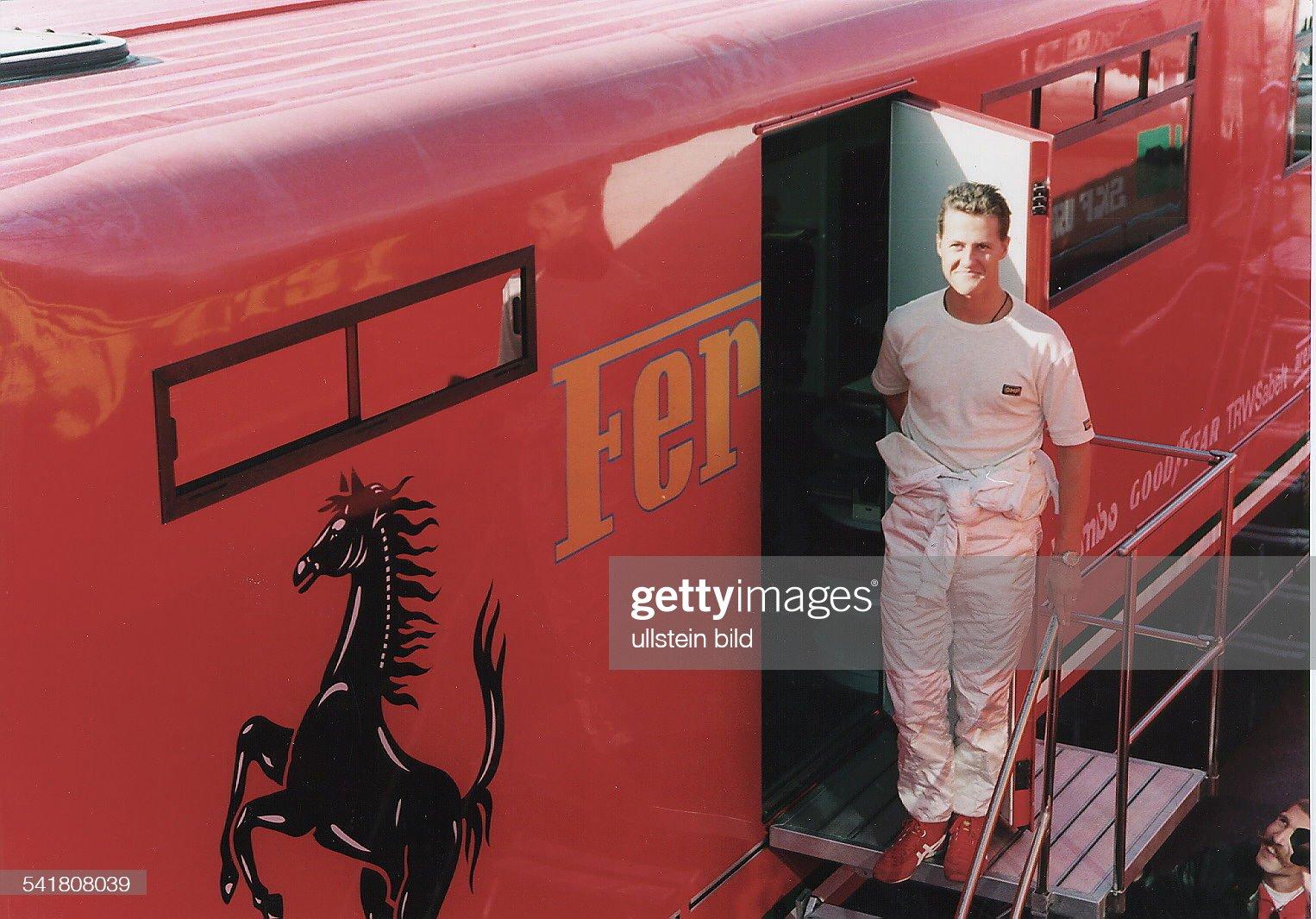 Michael Schumacher in front of the red Ferrari truck during test drives in Estoril, Portugal, in November 1995.