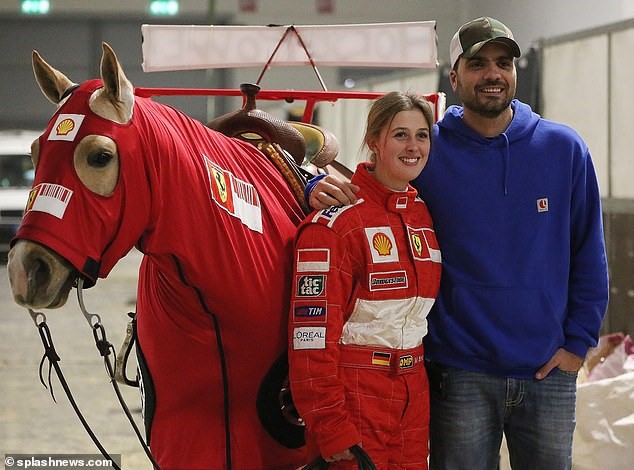 Michael Schumacher's daughter Gina donned a Ferrari boilersuit and helmet for the horse riding event in Verona, dressing her horse in a similar look.