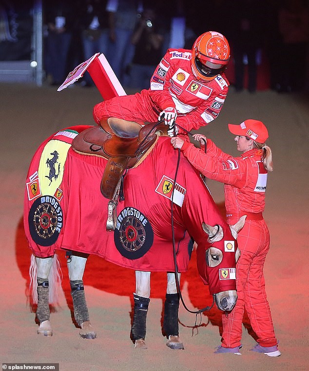 The horse rider honoured her father with the Ferrari themed routine during a freestyle competition in Verona. Pictured performing a pit-stop.