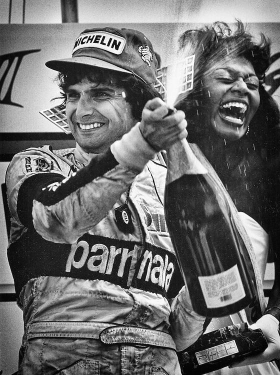 Two-time Brazilian World Driving Champion Nelson Piquet celebrates his victory in the 1984 Detroit Grand Prix, driving the Parmalat- MRD-Brabham-BMW BT53.