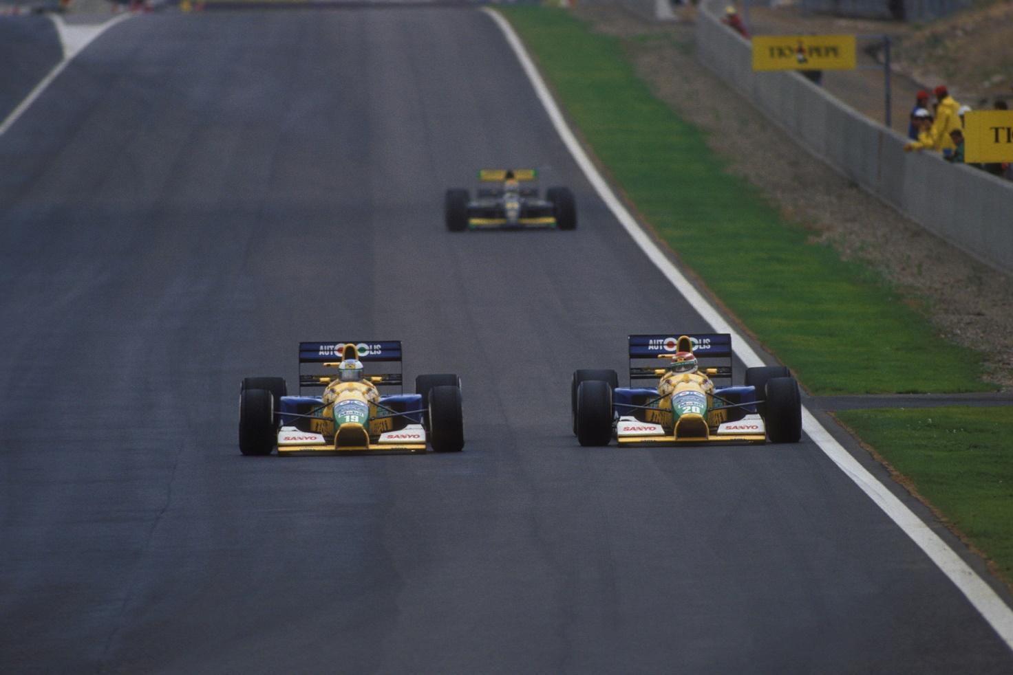 Michael Schumacher passes team mate Nelson Piquet in the 1991 Spanish Grand Prix.