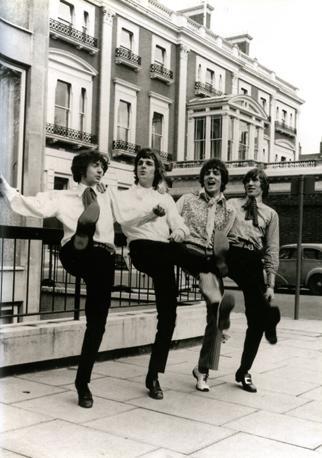 Pink Floyd celebrate their first contract with Emi by staging a joyful ballet. From left: Nick Mason, Rick Wright, Syd Barrett and Roger Waters.