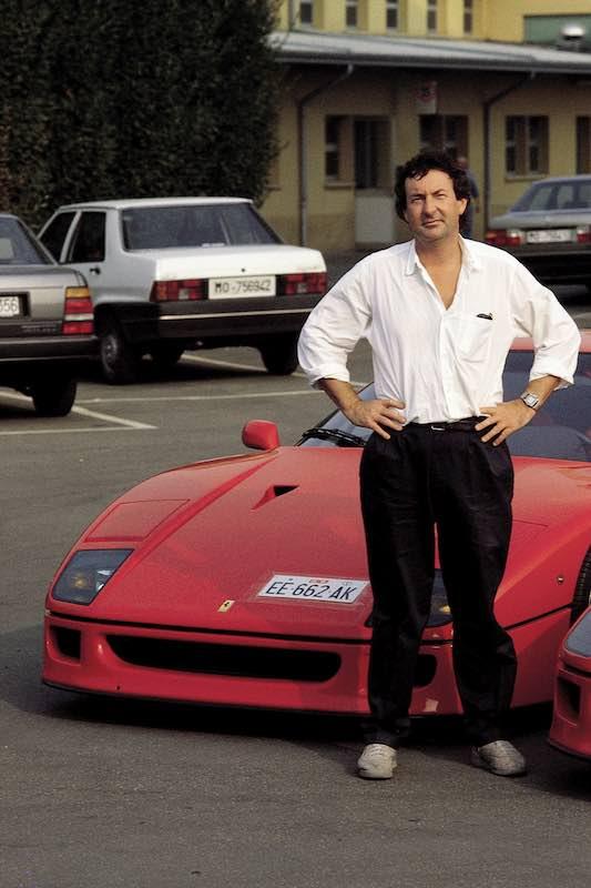 Nick Mason in front of his red Ferrari.