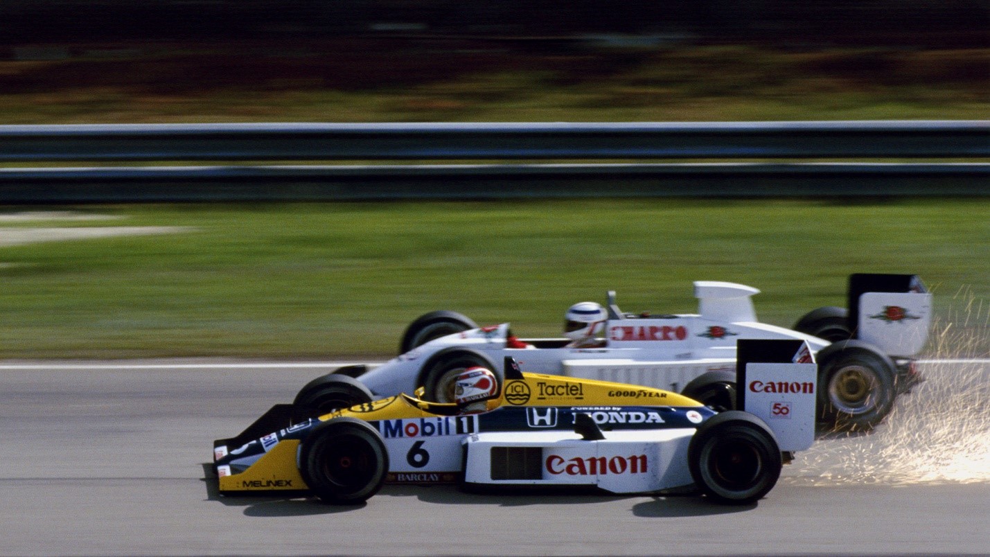 Piquet became the third Williams World Champion in '87, here overtaking Pascal Fabre in Brazil. 