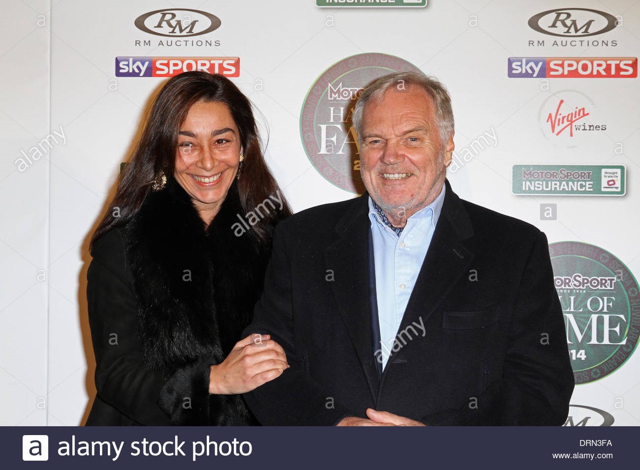 London, UK. 29th January 2014. Patrick Head and his wife attend the Hall of Fame 2014 charity auction. 