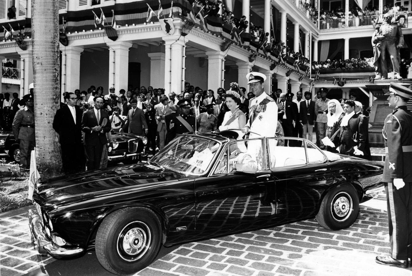 Prince Philip in a black Jaguar.