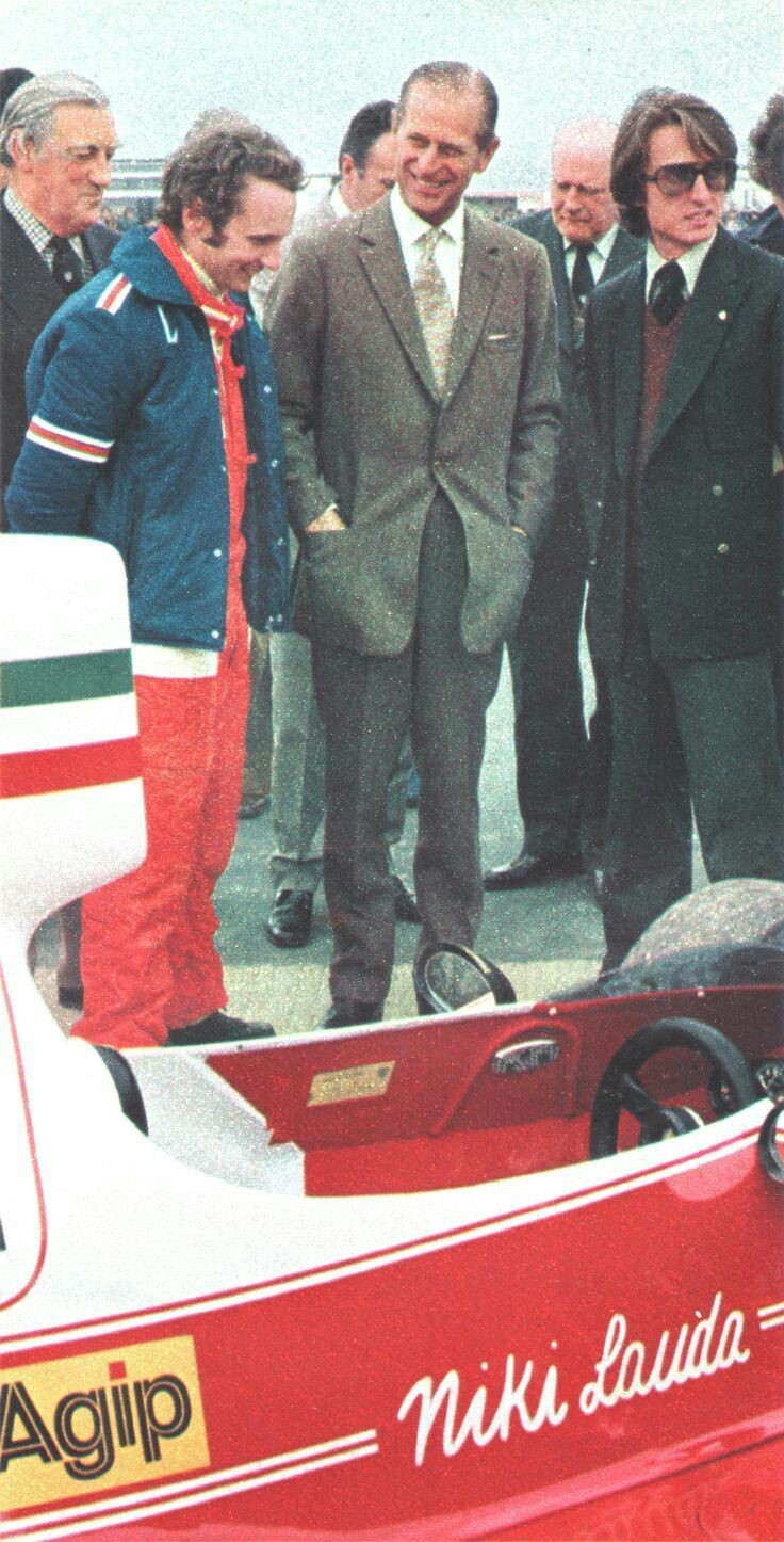 Prince Philip, sharing a joke with, then, Ferrari driver Niki Lauda at Silverstone's International Trophy in 1975. Ferrari team manager Luca Montezemolo looks on.
