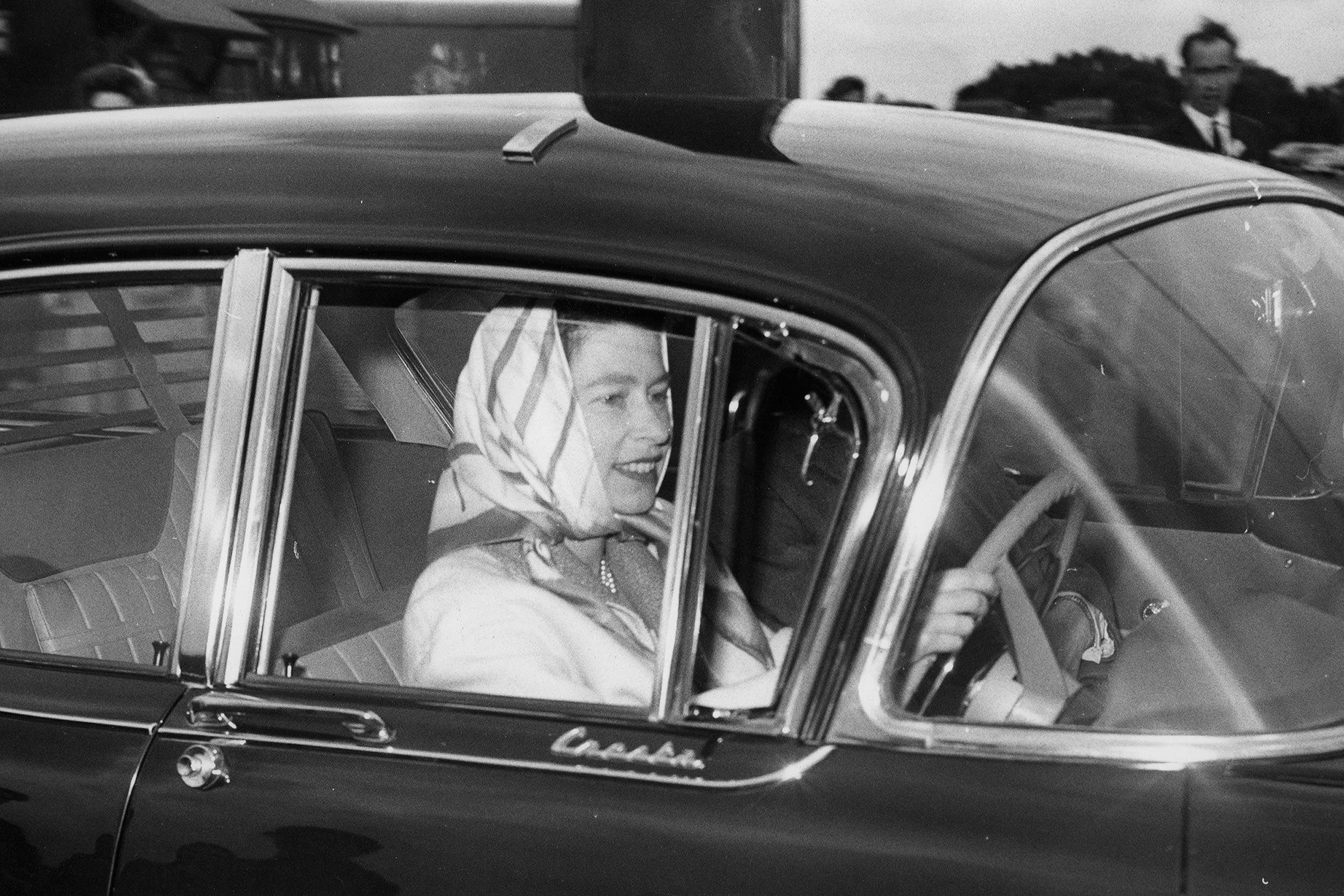 Queen Elizabeth driving a car.