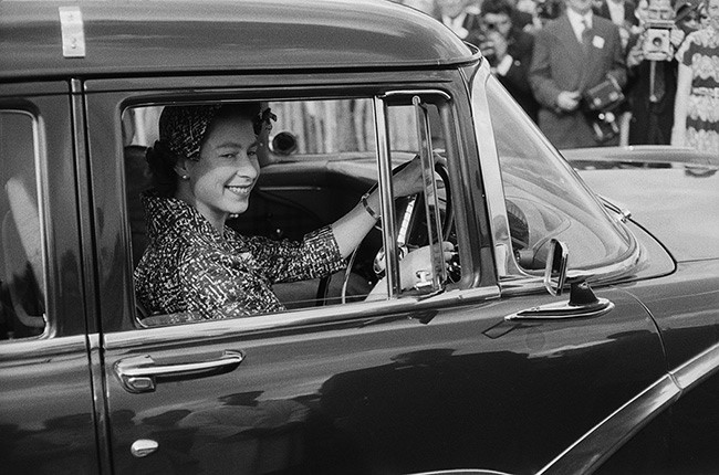 Queen Elizabeth driving a car.