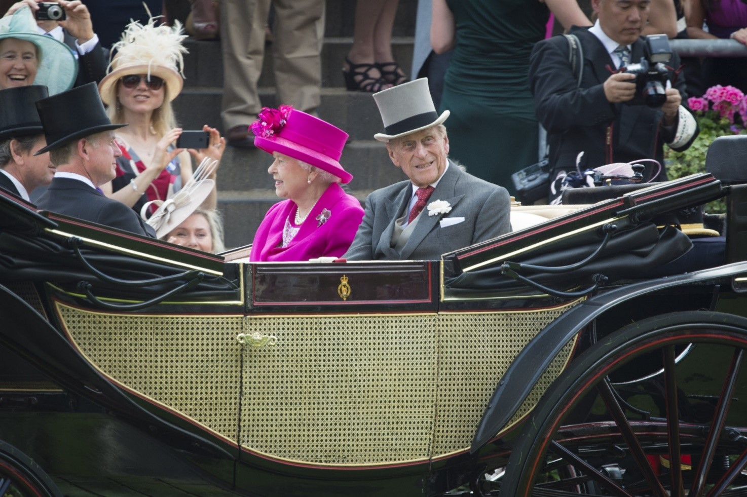 The Queen and Prince Philip in a carriage.