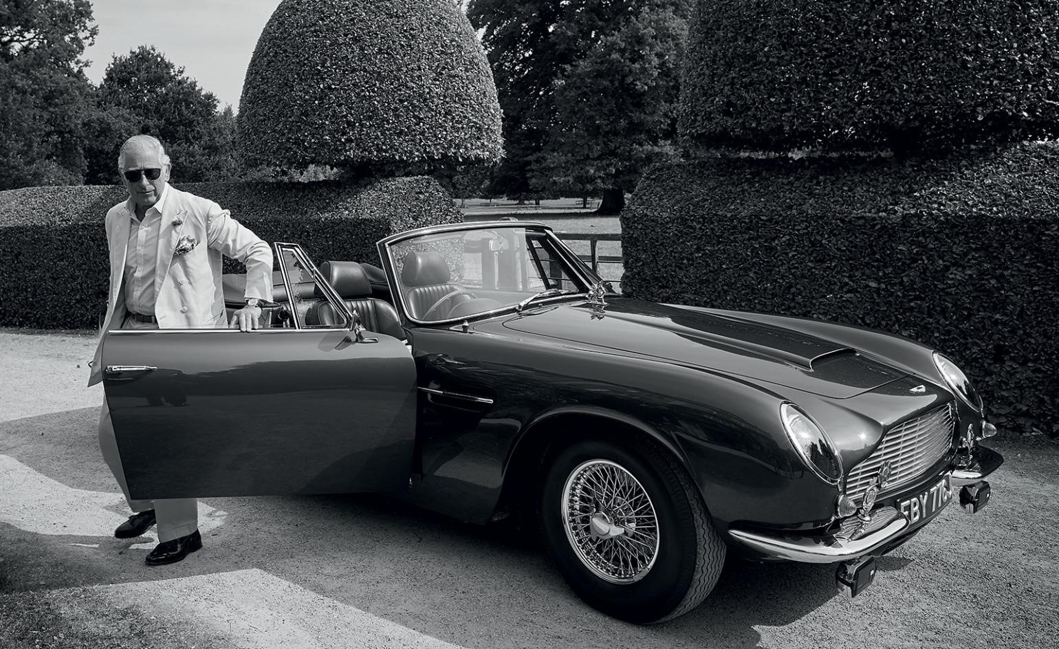 Prince Charles steps from his 1969 Aston Martin DB6 MKII Volante in the grounds of the Highgrove Estate in Gloucestershire. 