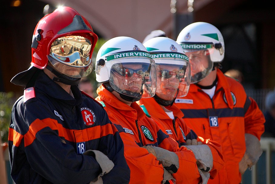 Marshals stand in line alongside the track at Monte Carlo in June 2010