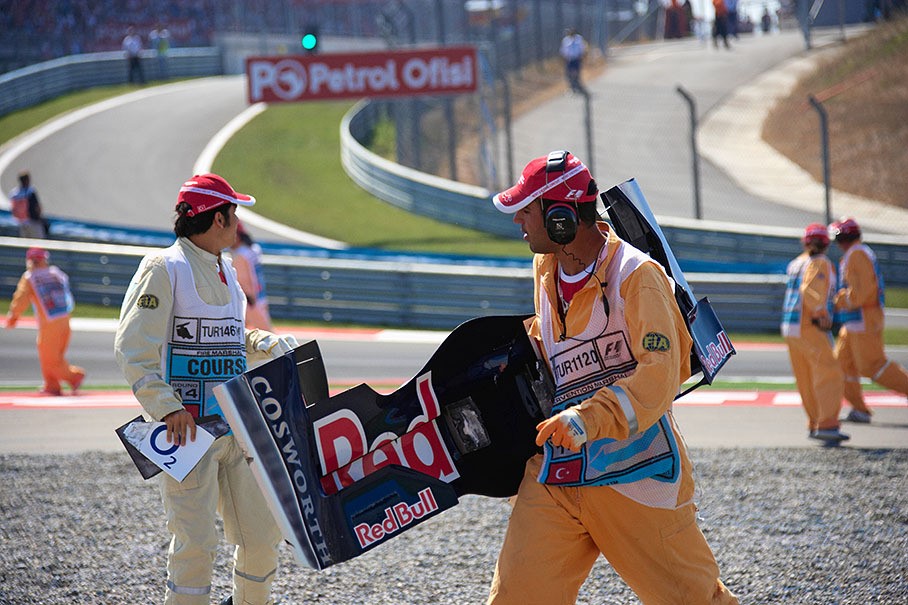 Turkish track marshal collecting Speeds front wing which slashed Raikkonen's rear tyre at Istanbul in 2006. 