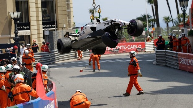 Marshals attend to the Williams driven by Lance Stroll after a crash in practice at Monaco in 2017. Race stewards help protect the marshals and other trackside workers. 