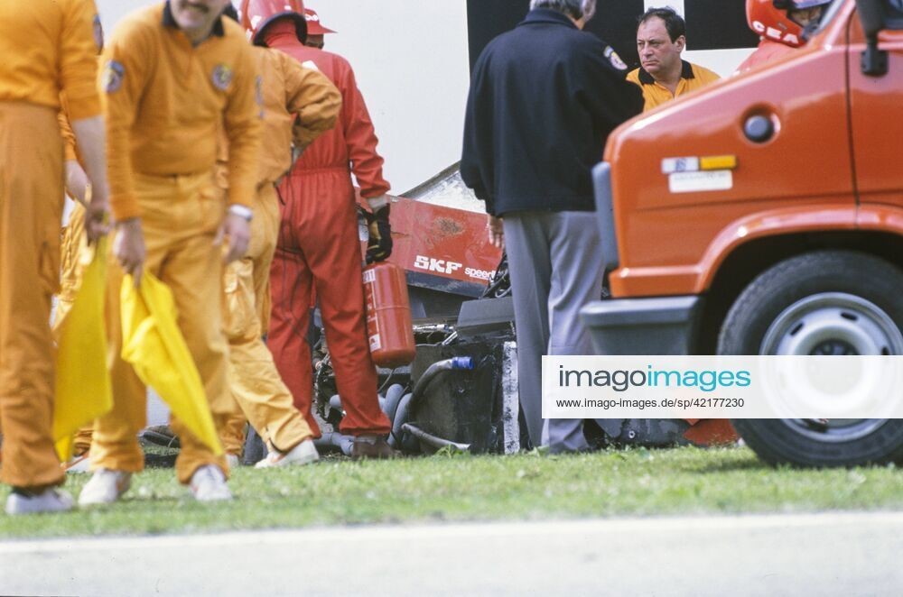 Marshals attend Gerhard Berger s Ferrari 640 after an accident during the San Marino GP at Imola, Italy, on April 23, 1989.