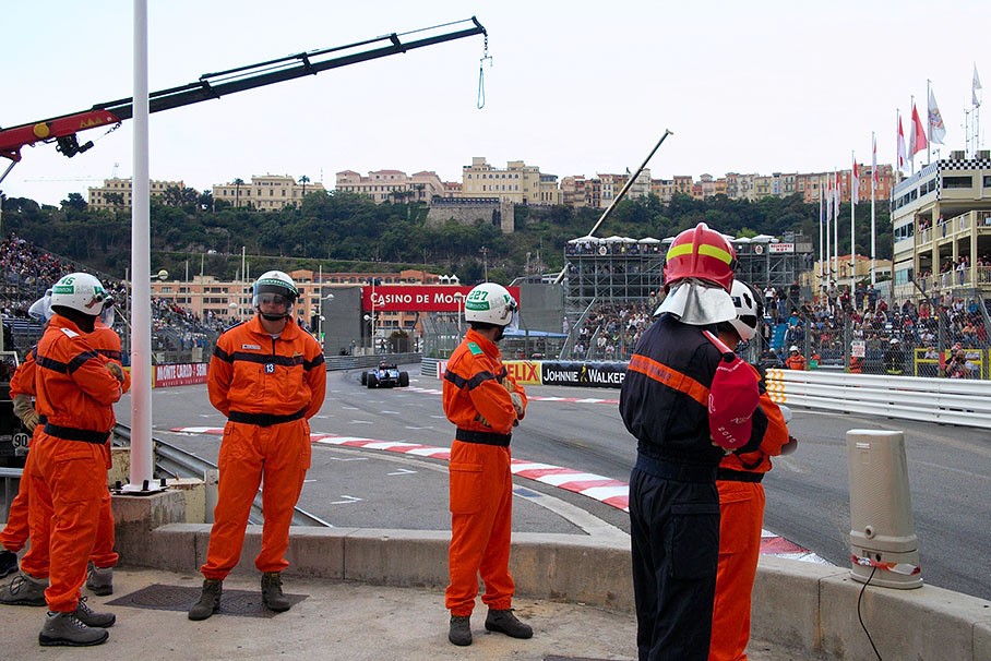 Marshals take care at the Piscine chicane, Monaco, June 2010. 