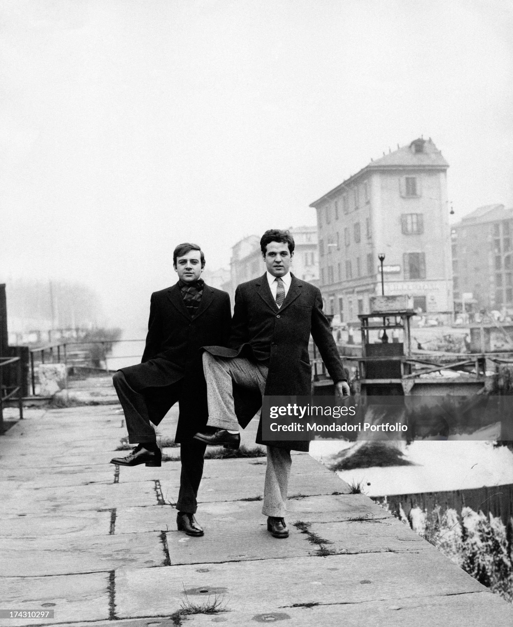 Cochi Ponzoni and Renato Pozzetto doing a step from one of their sketches in a street along the Naviglio in Milan in February 1968. 
