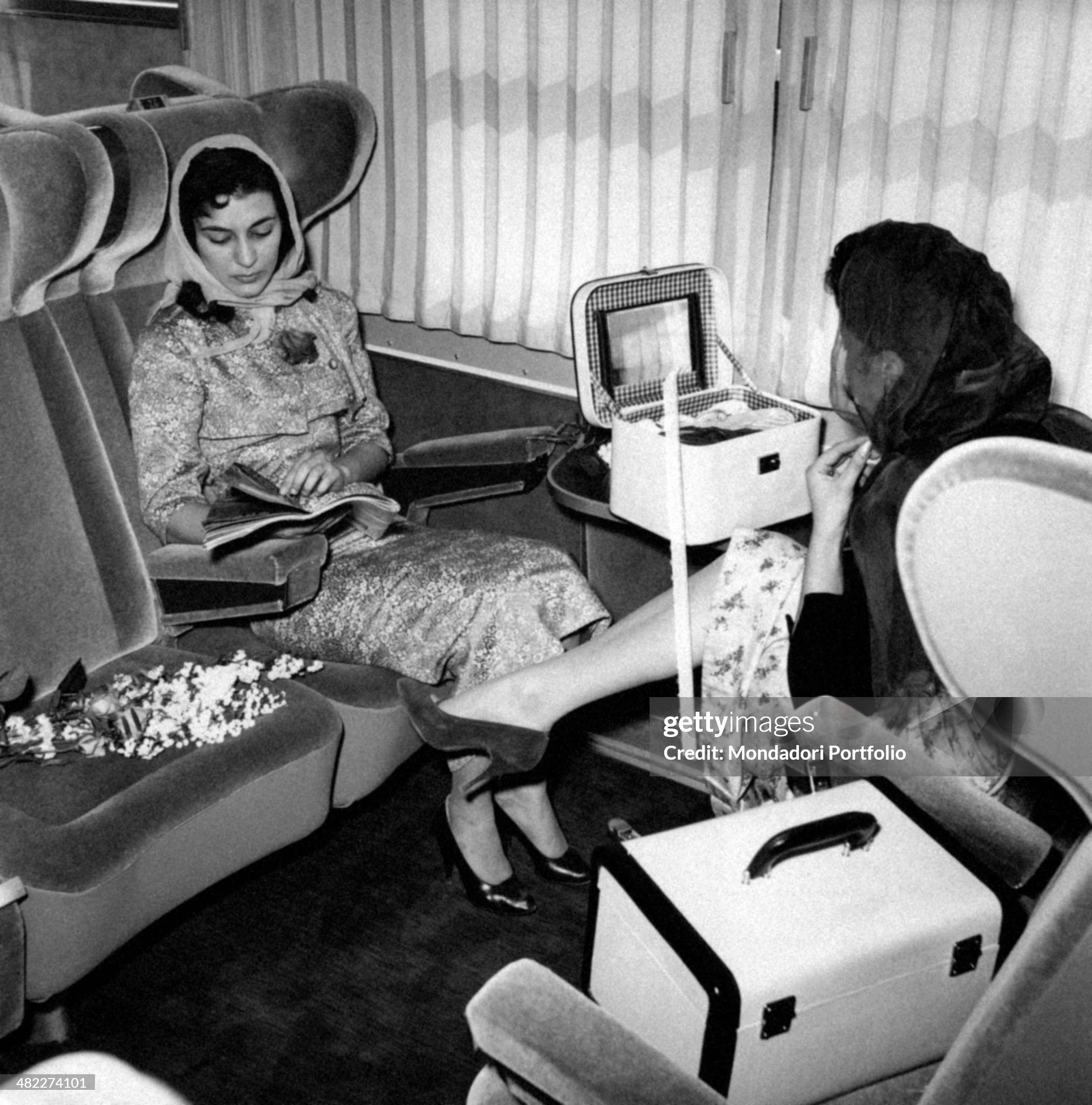 A Trans Europ Express railcar travelling between Como and Milan, Italy, to be tried out. A woman reading in a carriage in 1957.