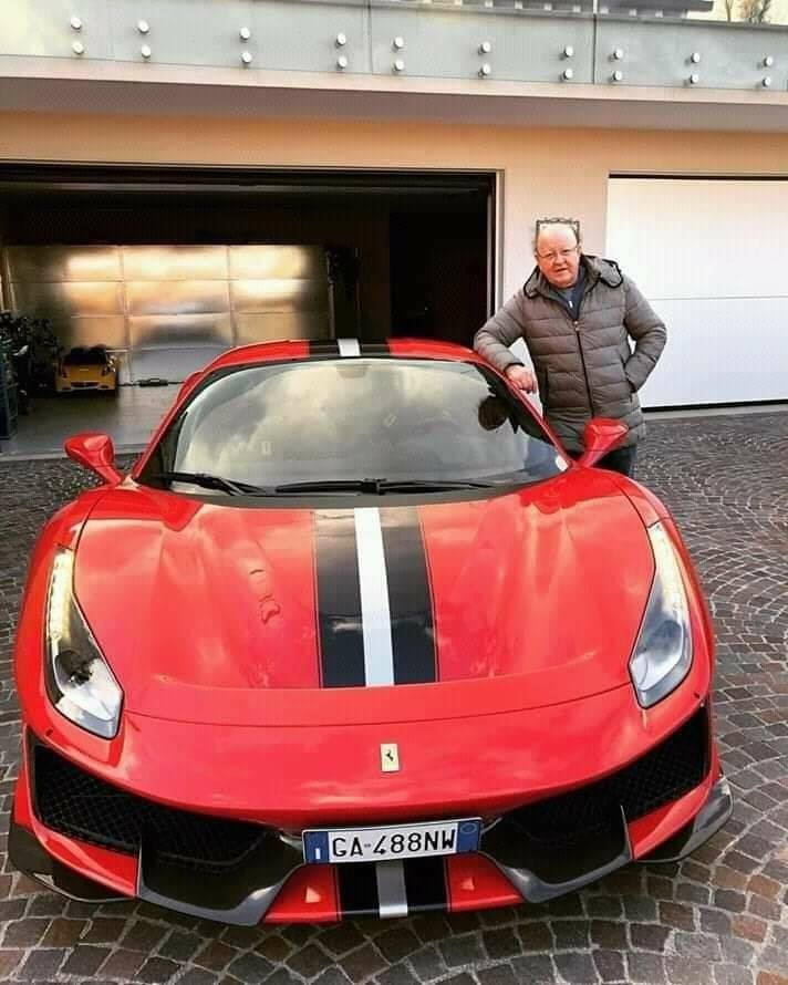 Massimo Boldi and his red Ferrari.
