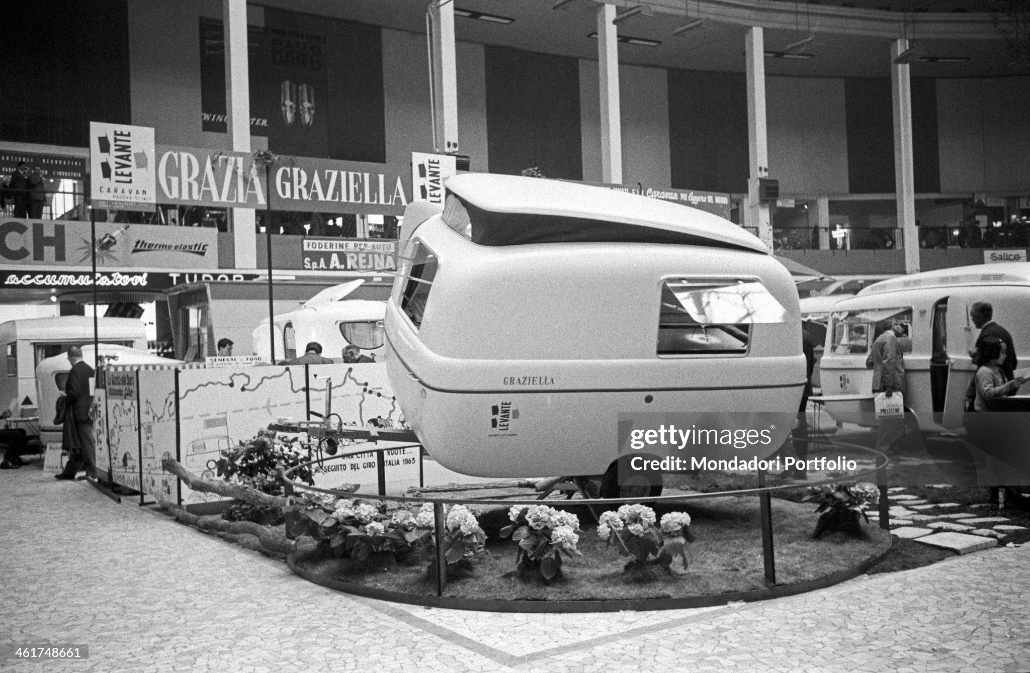 A Levante Graziella 300, a small but effective caravan named after the newspaper Grazia, is shown on the rotating platform into a stand within the Fair of Milan in April 1963.
