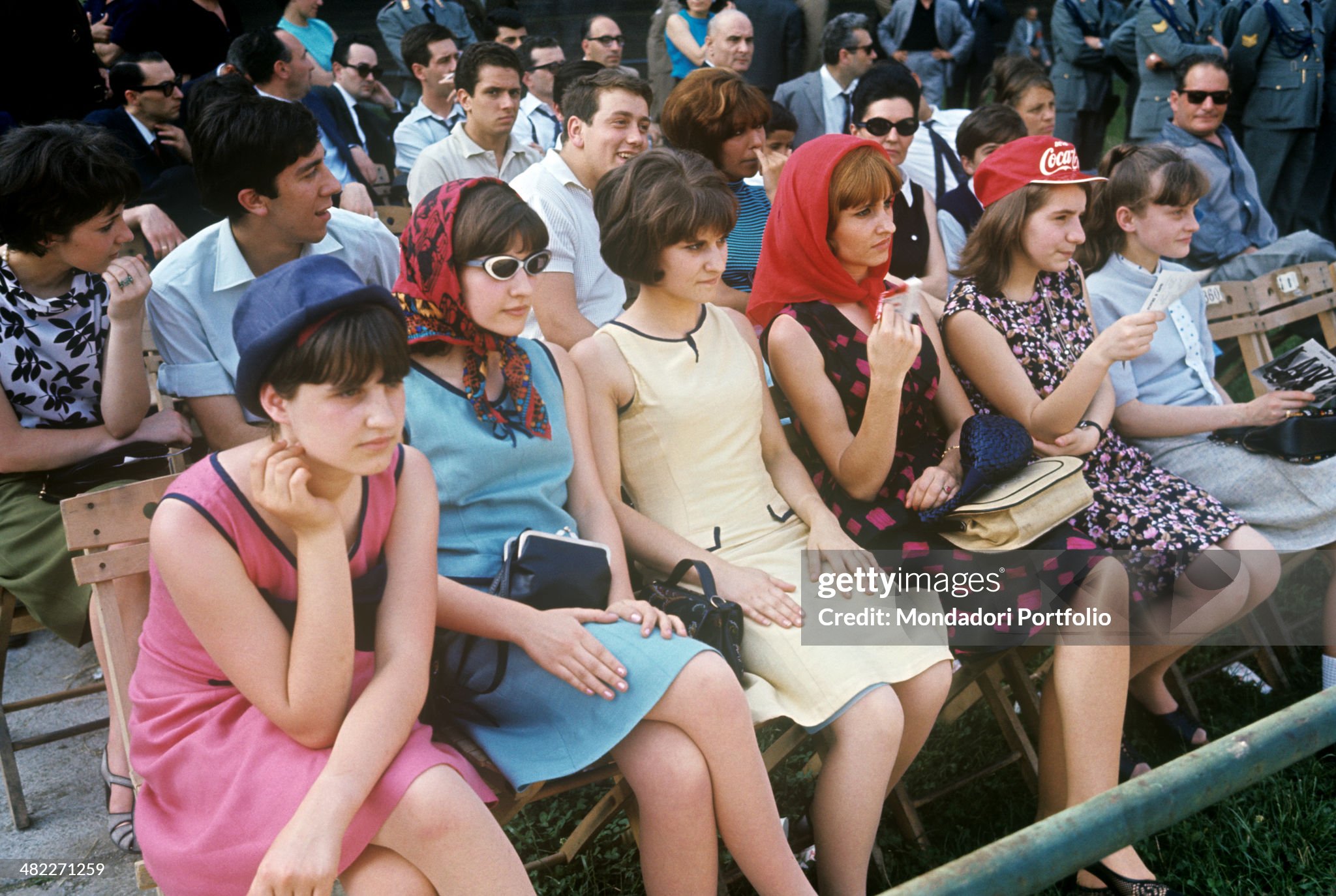Some young Italian fans attending the concert of the rock band The Beatles at the Vigorelli Velodrome in Milan on 24 June 1965. 
