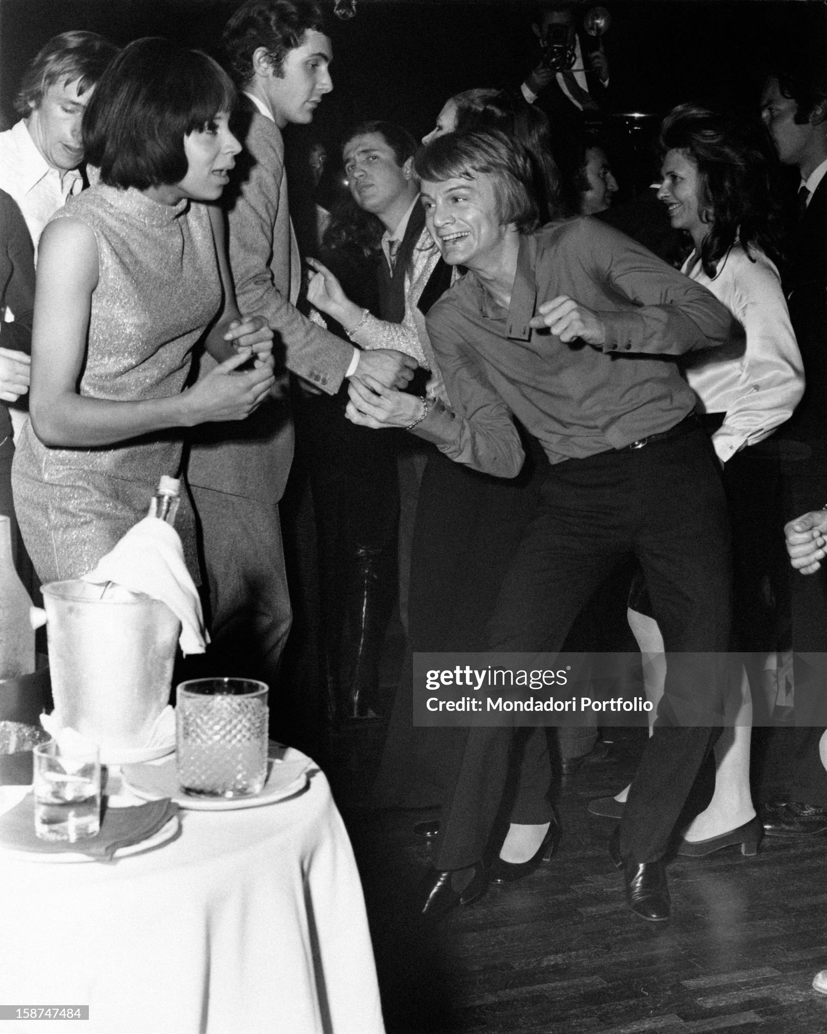 Egyptian-born French singer and musician Claude Francois dancing in a famous club in Milan in 1969. 
